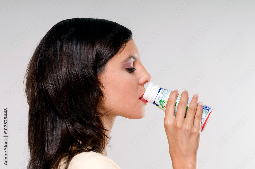 Woman drinking yogurt