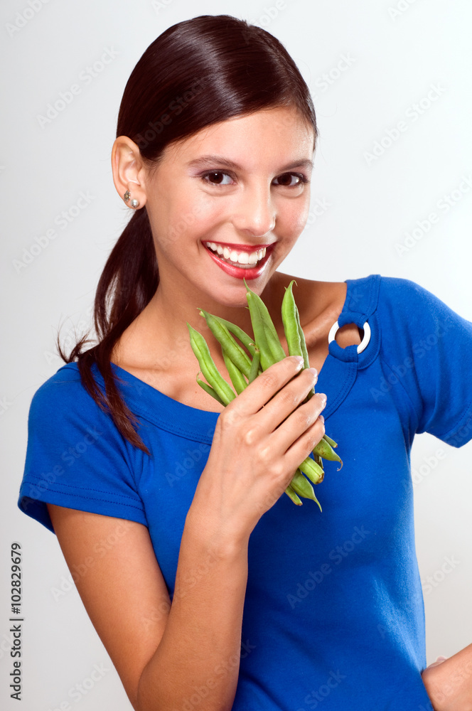 Woman showing some vegetables Woman showing some vegetables