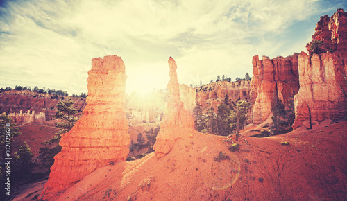 Vintage toned sunset in Bryce Canyon with lens flare effect