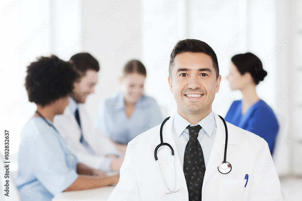 happy doctor over group of medics at hospital happy doctor over group of medics at hospital