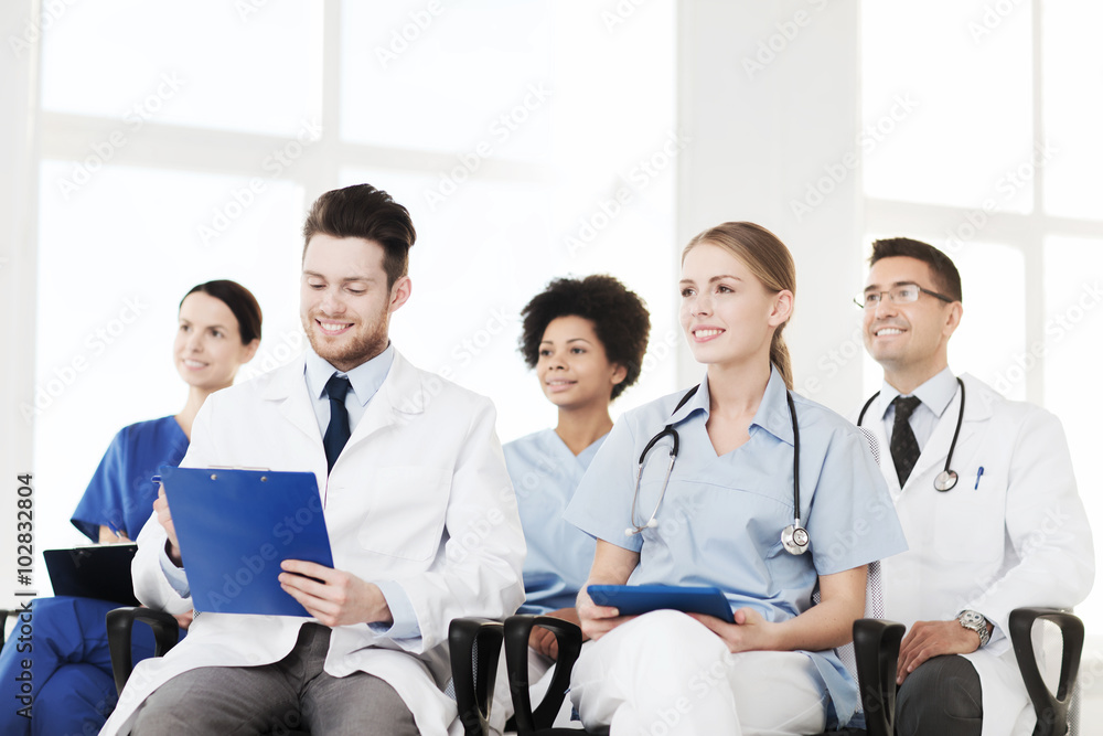group of happy doctors on seminar at hospital group of happy doctors on seminar at hospital