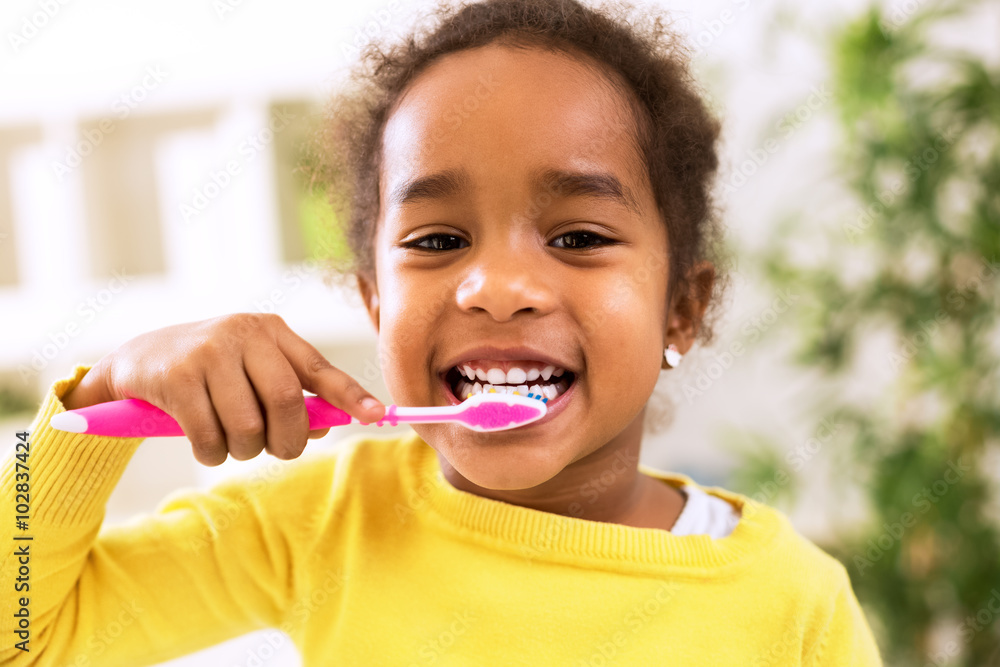Little beautiful african girl brushing teeth Little beautiful african girl brushing teeth