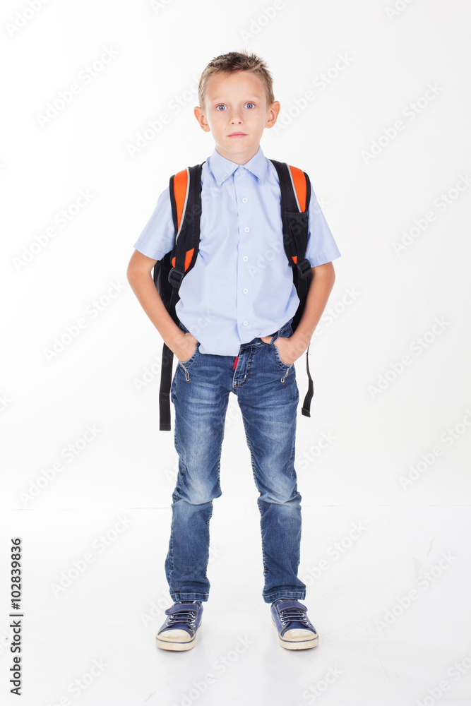 Fototapeta premium Serious school boy isolated on white