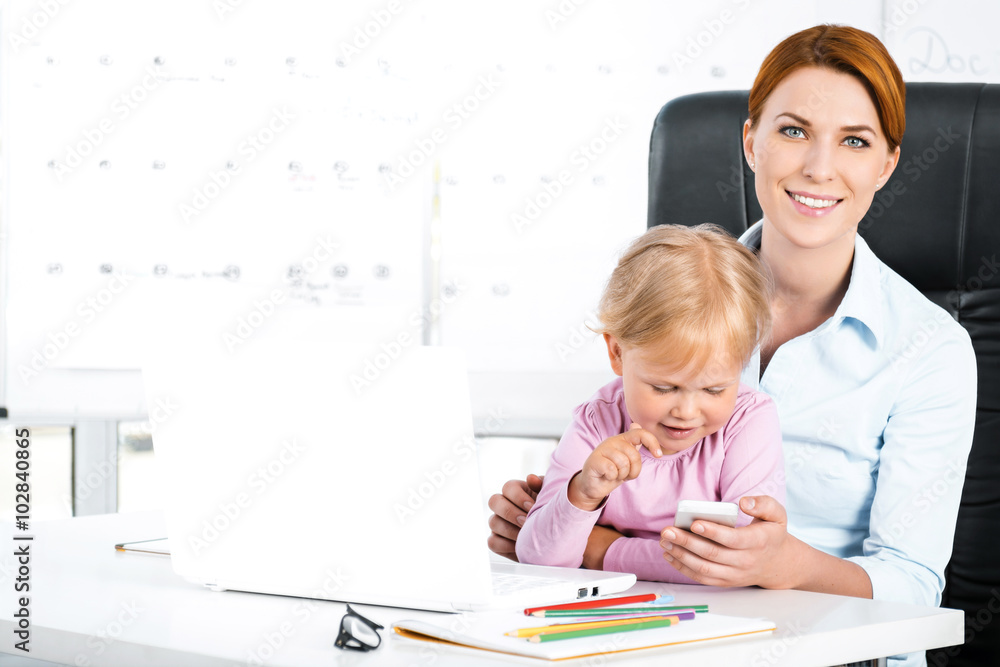 Business woman and daughter while working day Business woman and daughter while working day