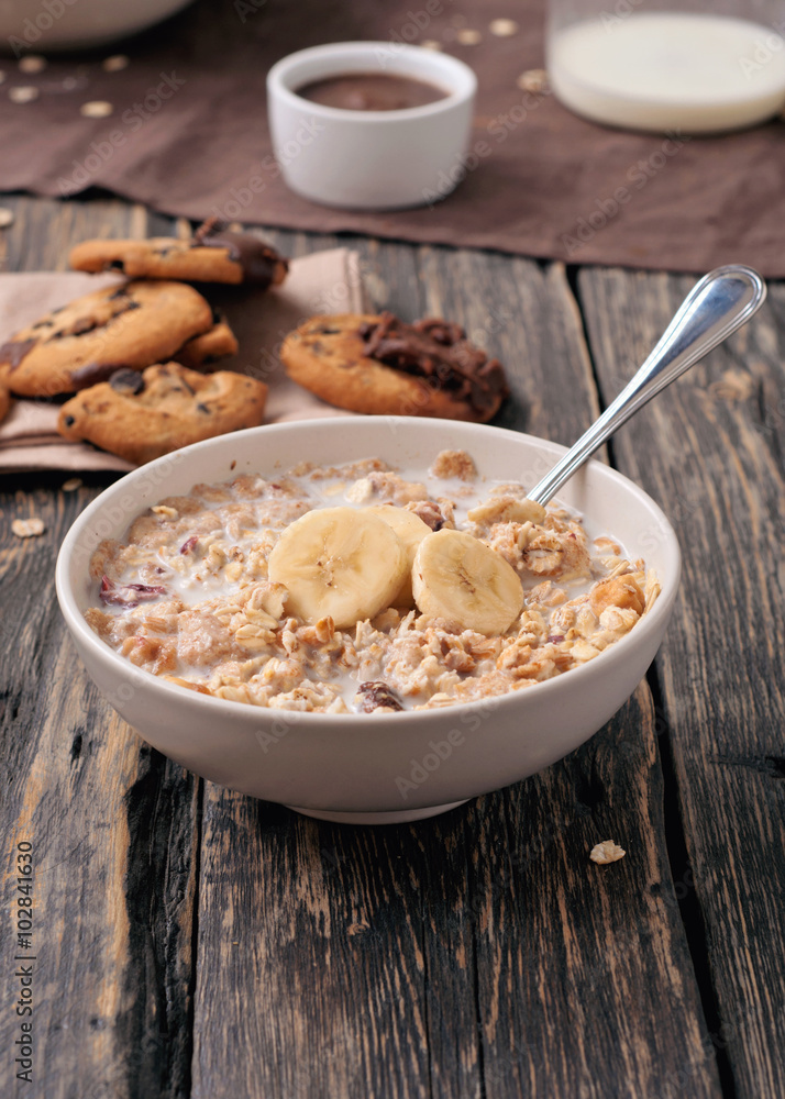 healthy breakfast of oatmeal with bananas in white bowl healthy breakfast of oatmeal with bananas in white bowl
