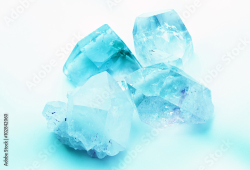 Beautiful ice blue Aquamarine colored semiprecious quartz rock crystals photo