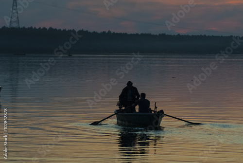 Fishing boat on the lake in the night