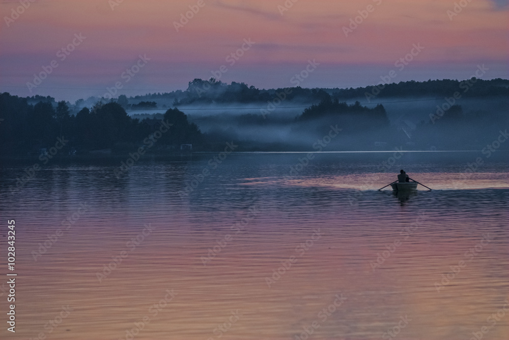 Fishing boat on the lake in the night