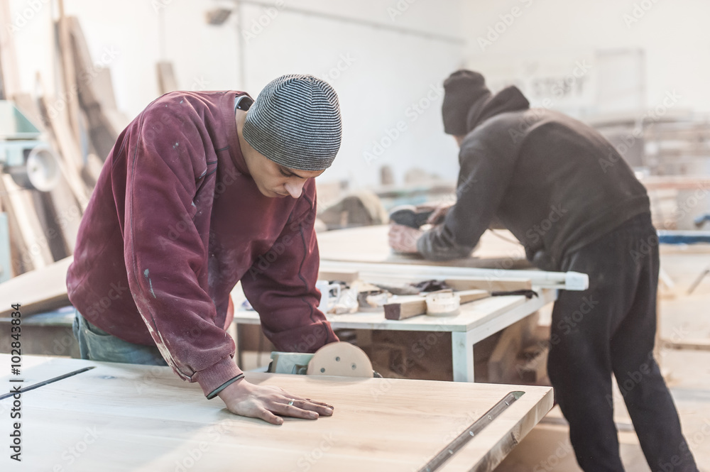 Carpenter Using Electric Sander / Carpenter sanding a wood with sander Carpenter Using Electric Sander / Carpenter sanding a wood with sander