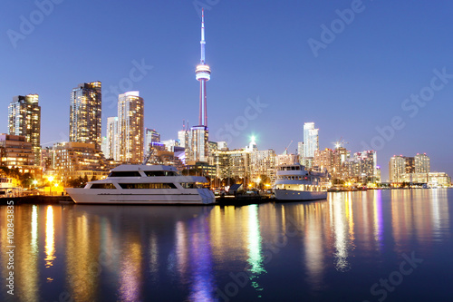 Toronto skyline at dusk with colorful reflections