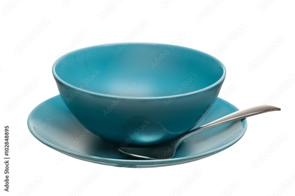 blue ceramic bowl with spoon and plate isolated on white background blue ceramic bowl with spoon and plate isolated on white background