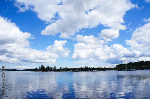 Finland lake with blue sky and clouds © skymoon13
