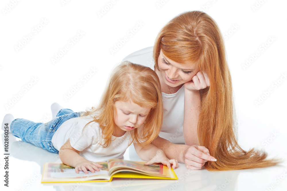 Fototapeta premium Mother with daughter are reading a book