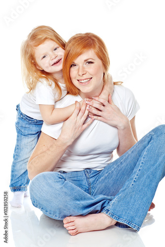 Mother with daughter in studio  white background 