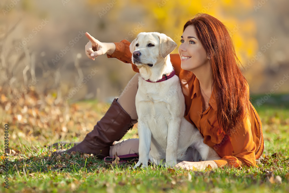 Woman with labrador on the nature