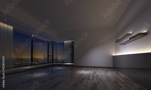 Dimly lit empty room facing urban skyline