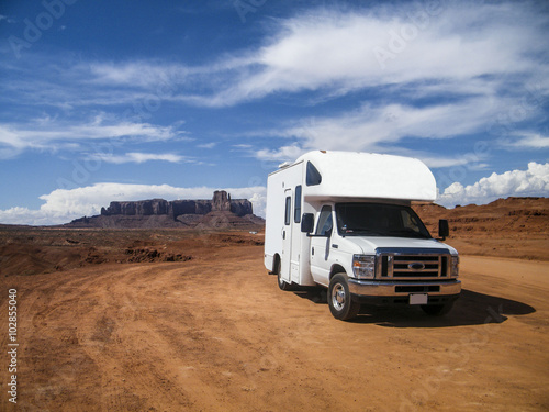 Fotografie, Obraz Monument Valley, Utah, United States - July 2011: A campervan in Monument Valley