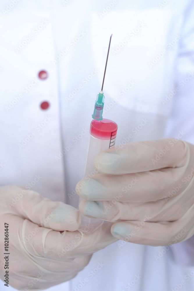 Syringe in the hands of doctor Syringe in the hands of doctor