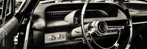 Obraz  z motywem interior of classic car with close up on dashboard with steering wheel. 