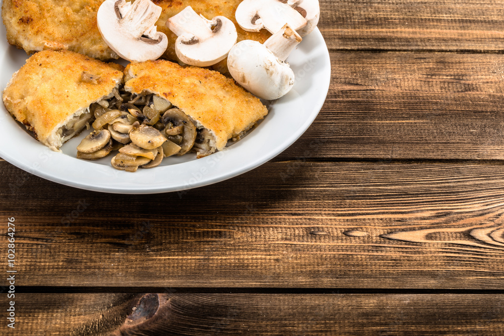Fried chicken kiev from chicken breast stuffed with champignons. Fried chicken kiev from chicken breast stuffed with champignons.
