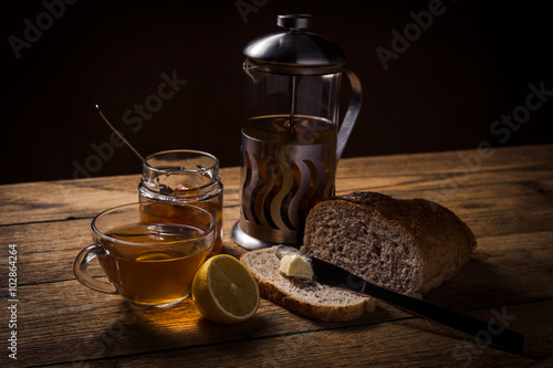Continental breakfast with bread, orange jam and tea