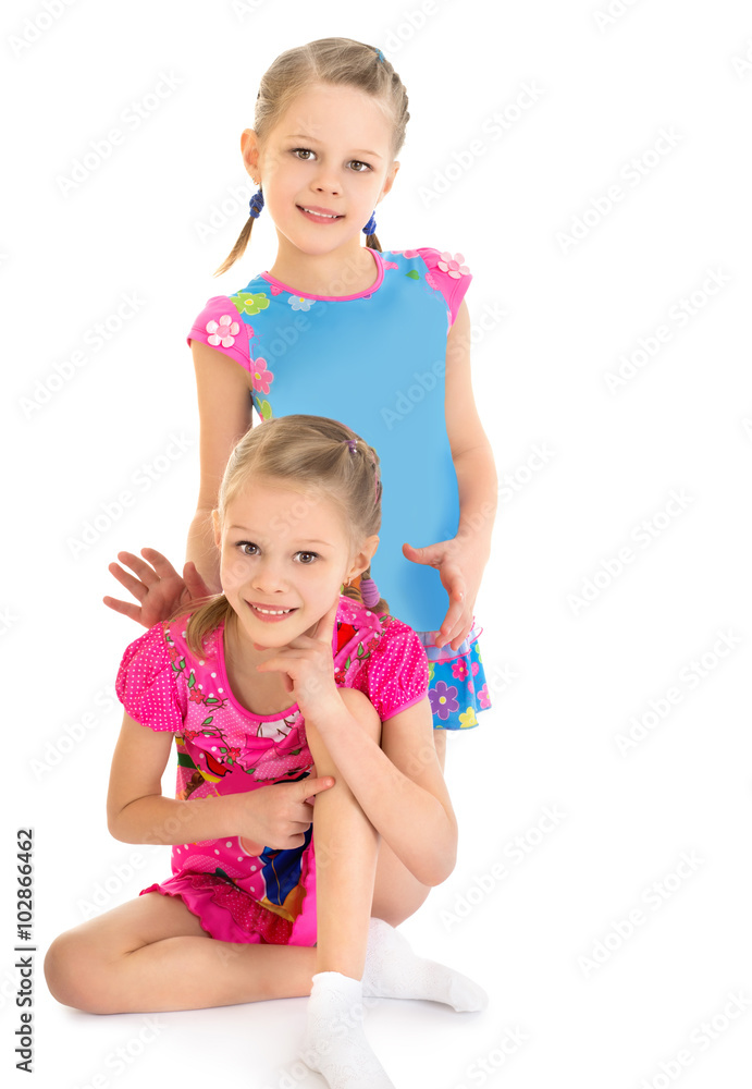 Two lovely girls in bright summer dresses - Isolated on white background Two lovely girls in bright summer dresses - Isolated on white background