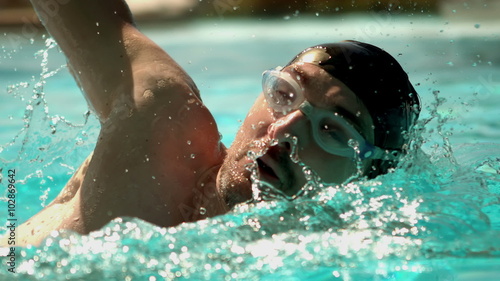 Fit man swimming in the pool