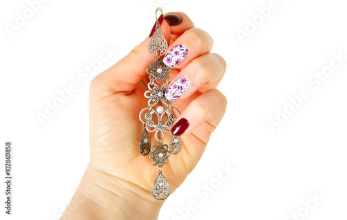 Modern fashion manicure with arabic style ear ring.