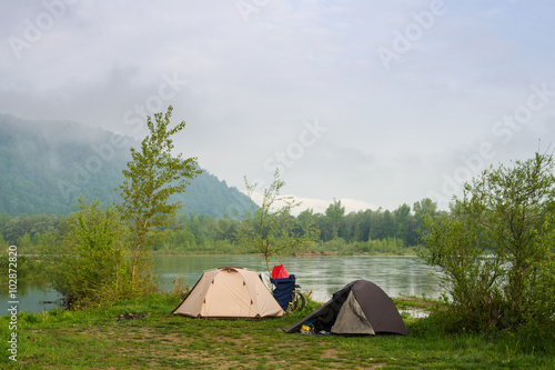 Camping by a river. Spring cycling trip in Transcarpathia