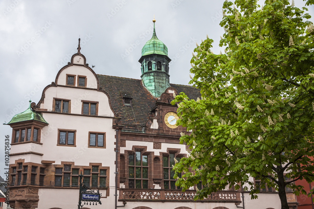 Obraz premium People walk on Town hall square in Freiburg im Breisgau, Germany