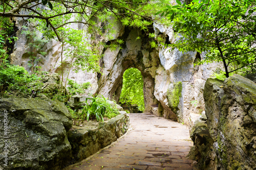 Scenic stone walkway leading to gate in rocks Scenic stone walkway leading to gate in rocks