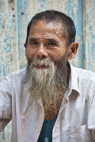 An 80 year old man from the ancient town Daxu in Guilin Guangxi Province China photo