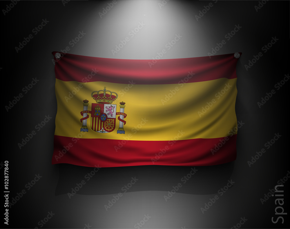 Obraz premium waving flag spain on a dark wall