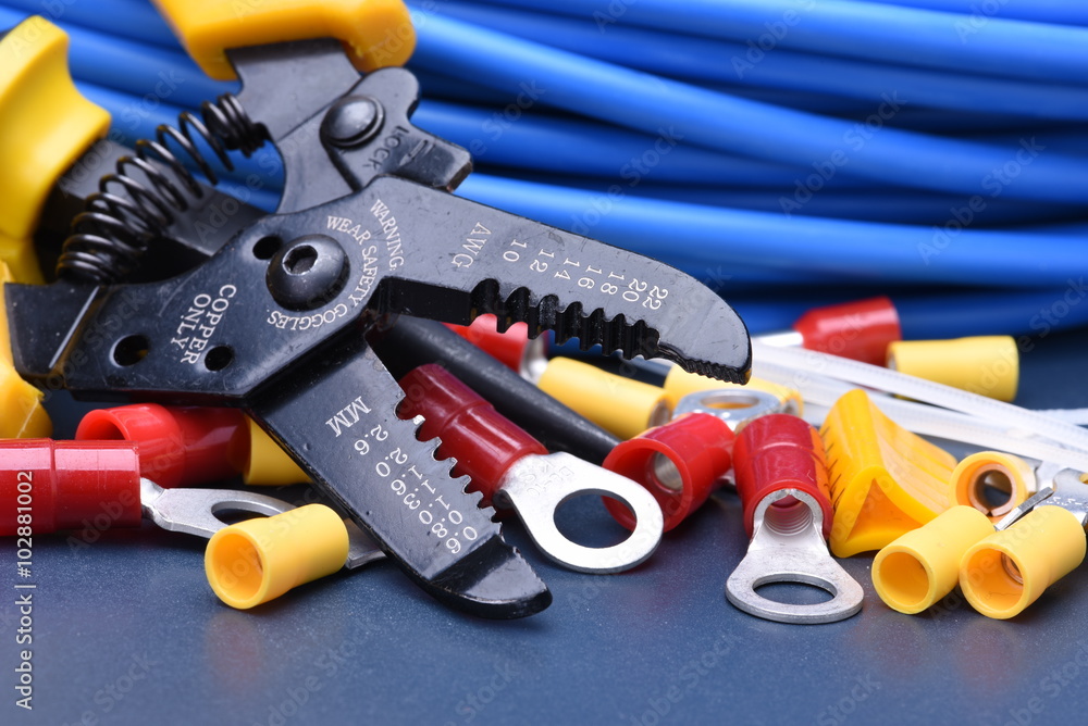 Fototapeta premium Tools for electrician and cables on metal surface