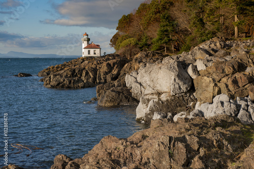 Line Kiln Lighthouse. Located on San Juan Island, in Washington state, It guides ships through the Haro Straits and is part of Lime Kiln Point State Park. It overlooks Dead Mans Bay. photo