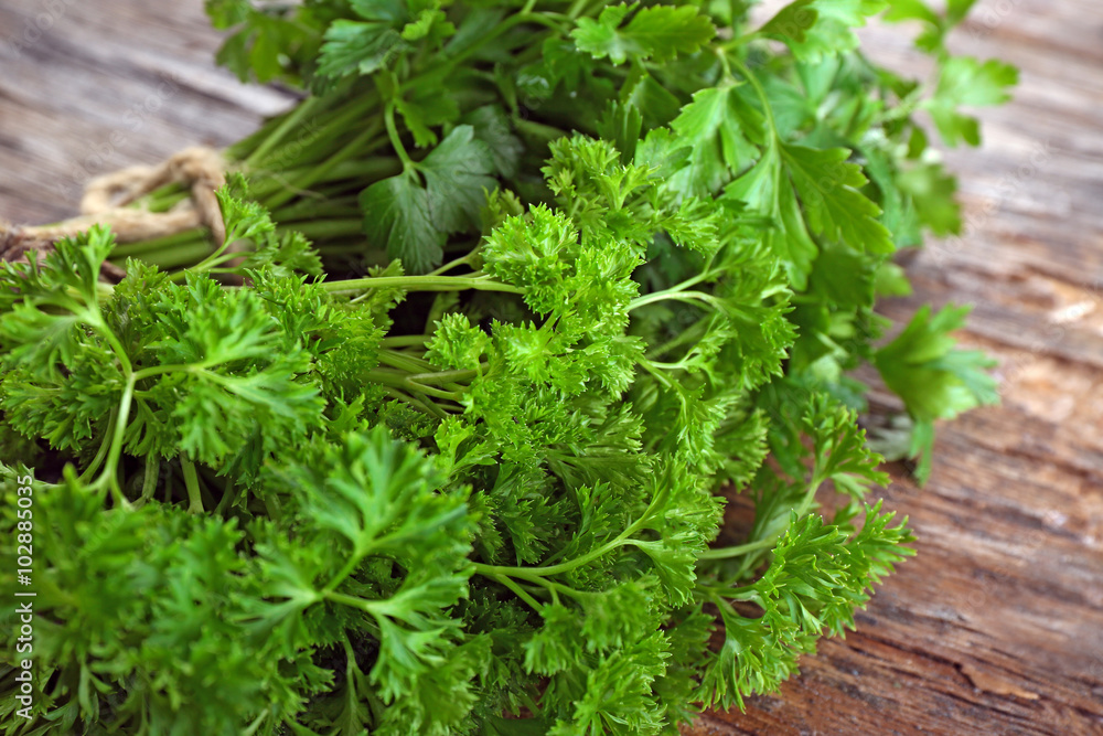 Fresh parsley on wooden background Fresh parsley on wooden background