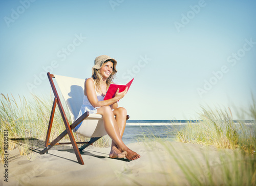 Woman Reading Book at Beach Relaxation Concept