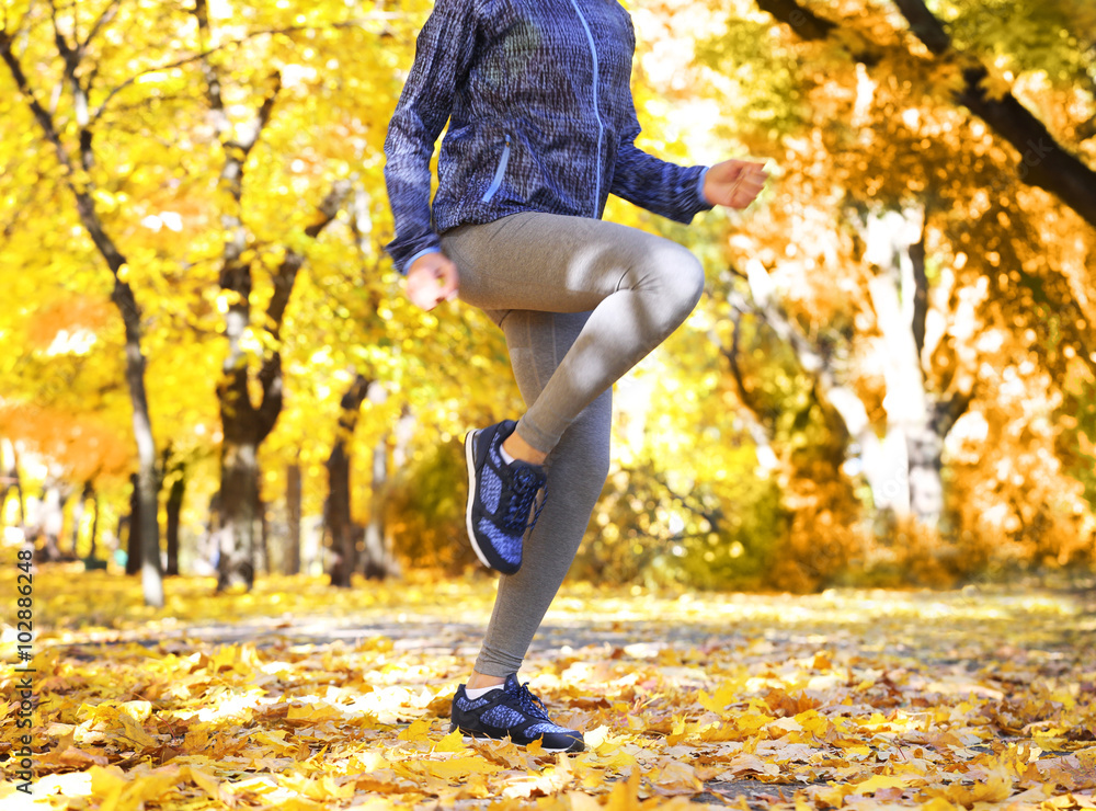 Young woman jogging in autumn park Young woman jogging in autumn park