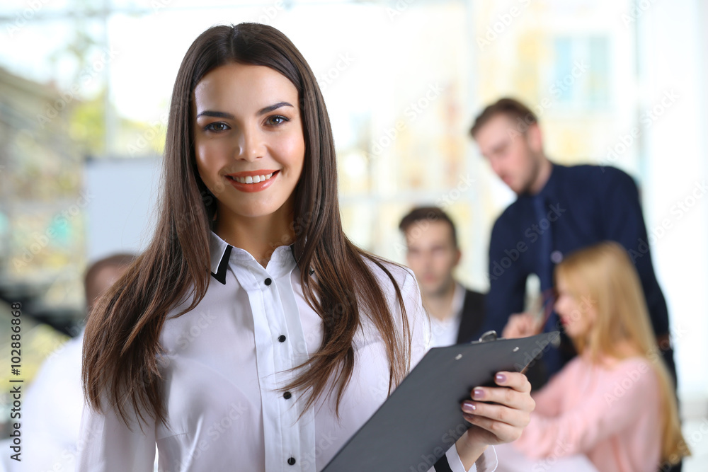 © Africa Studio - Young business woman at the meeting in a conference room © Africa Studio - Young business woman at the meeting in a conference room