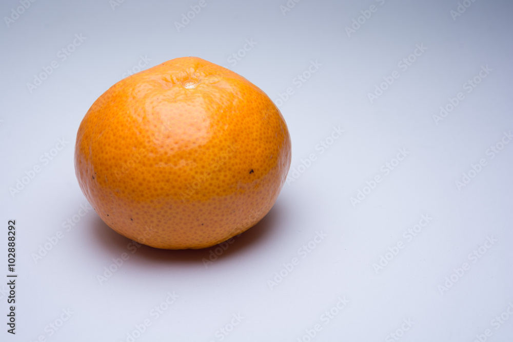 Tangerine isolated on light grey background Tangerine isolated on light grey background