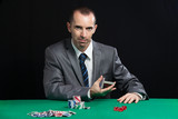 Casino worker shuffling cards
