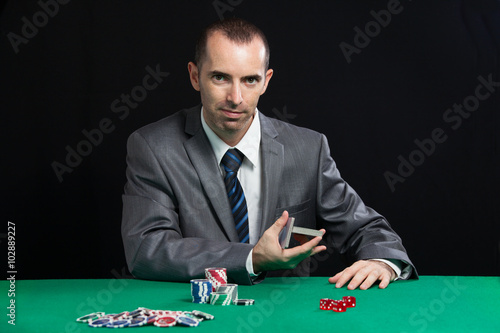 Casino worker shuffling cards