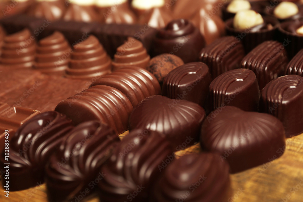 Assortment of delicious chocolate candies background, close up Assortment of delicious chocolate candies background, close up