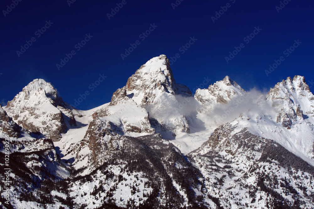 Grand Teton Peaks in Wyoming USA. The peaks / summits in the picture left to right are: Middle Teton (12,804 ft), Grand Teton (13,770 ft), Mt Owen (12,928 ft), Teewinot (12,325 ft)