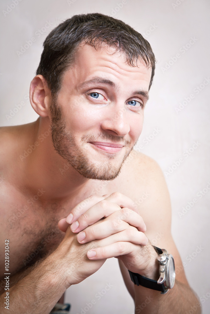 Fototapeta premium Portrait of smiling attractive man close up