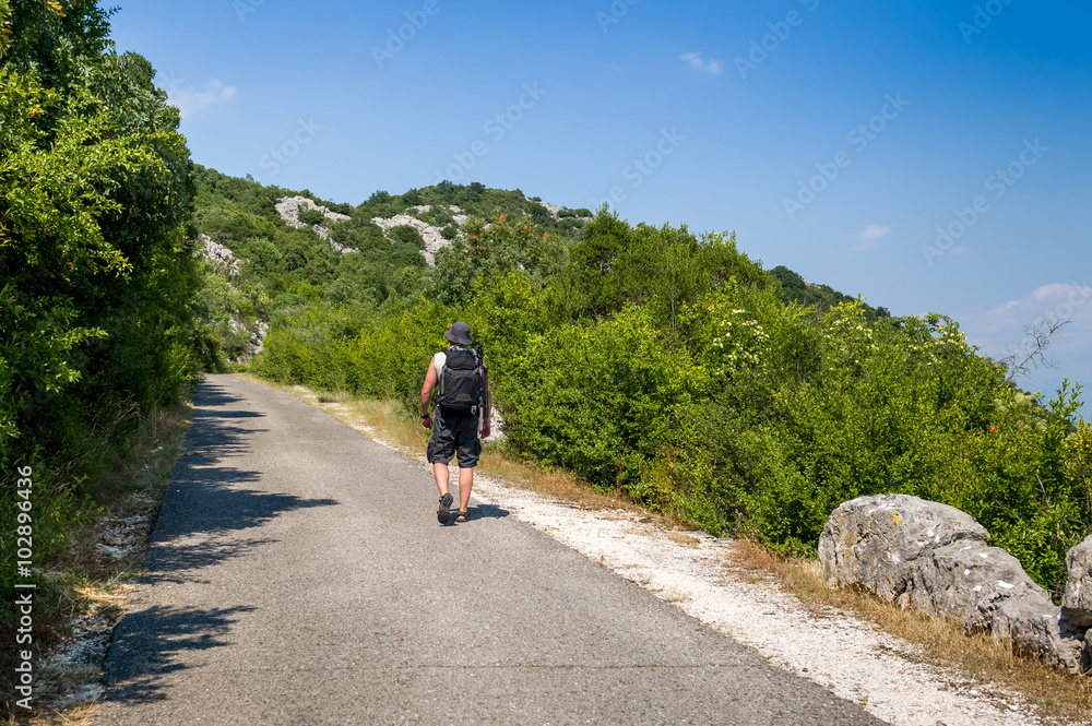 Treveller going up the hill in Montenegro.