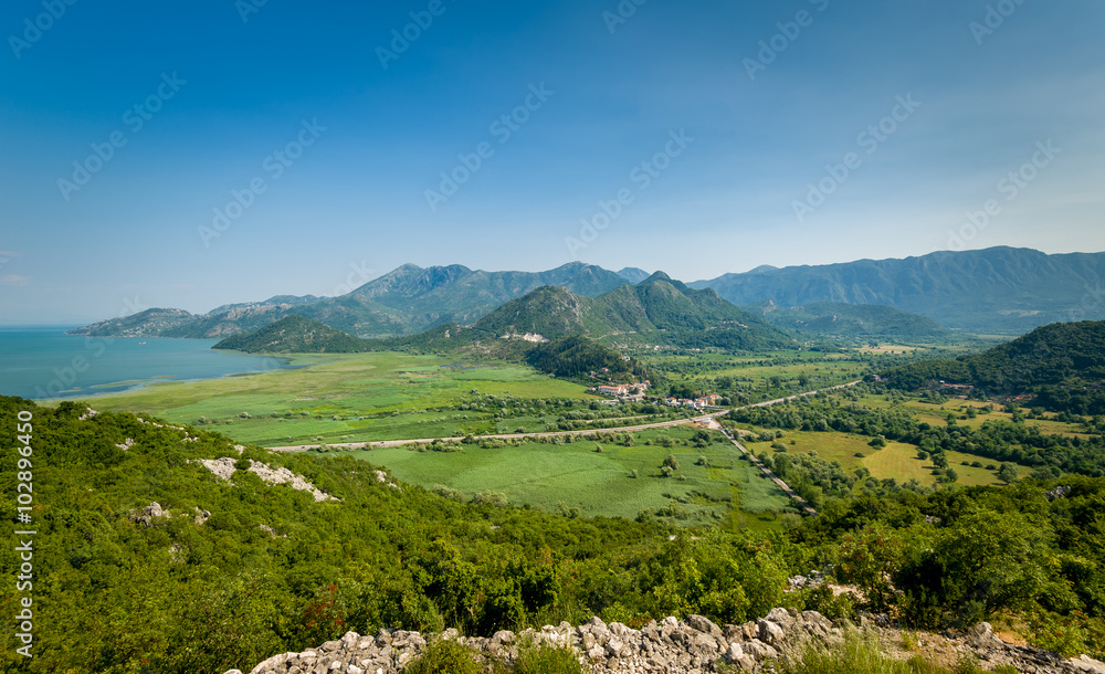 Montenegro landscape with Virpazar town, Skadar lake national park and the mountains range Montenegro landscape with Virpazar town, Skadar lake national park and the mountains range