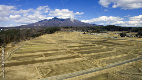空撮　八ヶ岳と田　