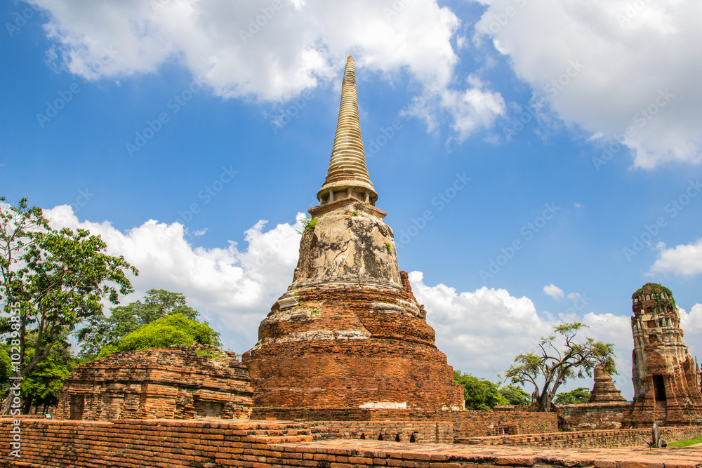 Fototapeta premium Tourist travel to visit ancient pagoda at Wat Mahathat temple, Ayutthaya, Thailand
