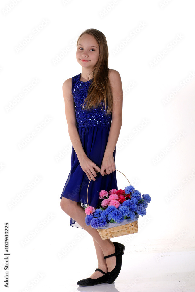 Beautiful girl with a basket of flowers in spring. Beautiful girl with a basket of flowers in spring.